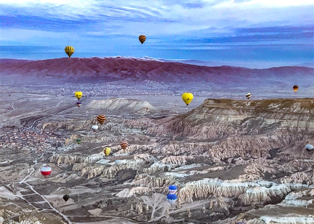 Hot air balloons drifting over Goreme Turkey